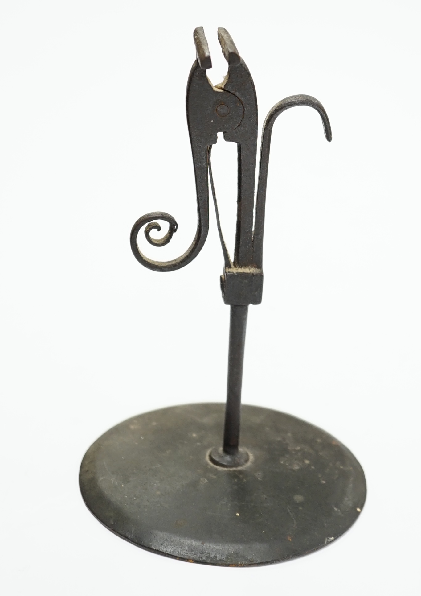 A late 18th century rush light, 15.5cm high